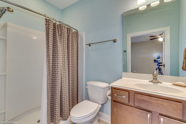 bathroom with ceiling fan, curtained shower, toilet, and vanity