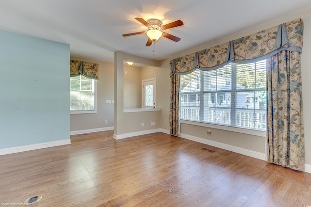 unfurnished room with ceiling fan and light hardwood / wood-style floors