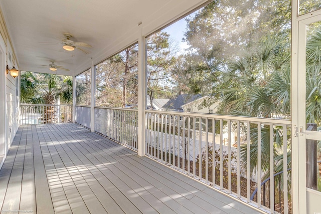 wooden terrace featuring ceiling fan