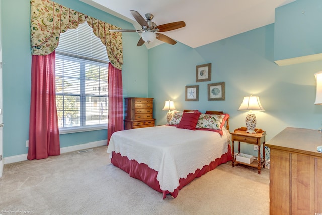 bedroom with ceiling fan and light carpet