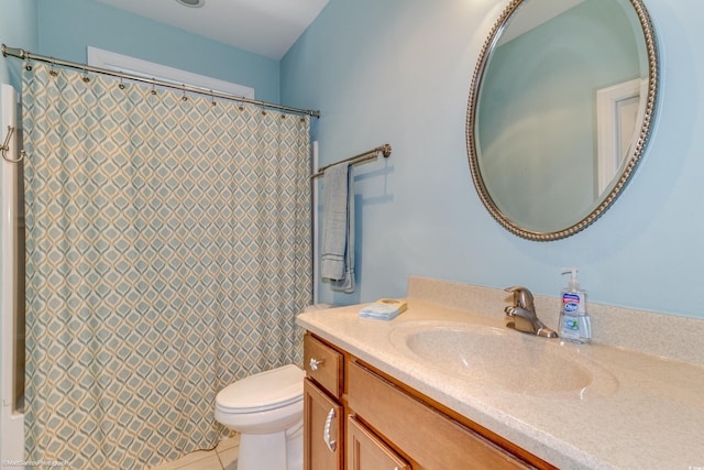 bathroom with tile patterned floors, vanity, and toilet