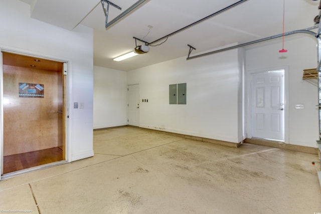 garage featuring electric panel and a garage door opener