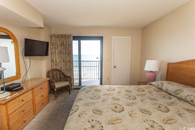 bedroom with carpet flooring and access to outside