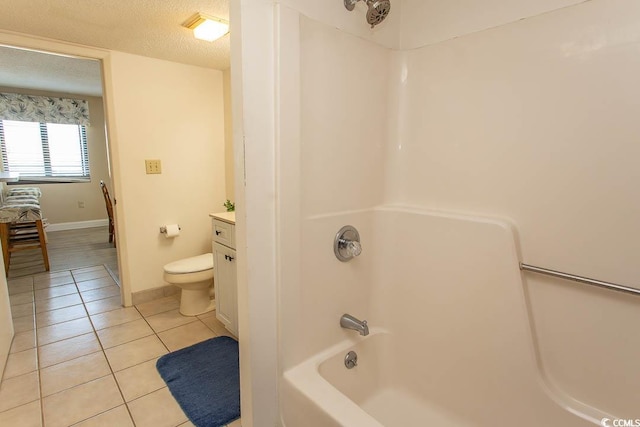 full bathroom featuring vanity, tile patterned flooring, toilet, a textured ceiling, and shower / bath combination