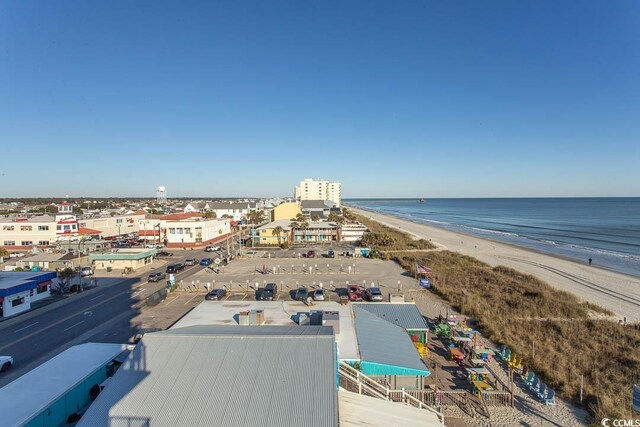 birds eye view of property featuring a water view and a view of the beach