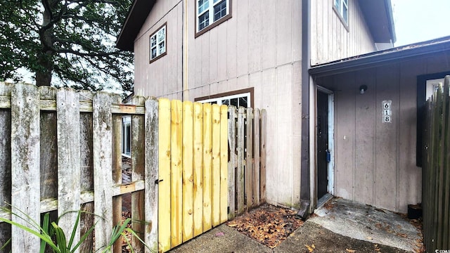 view of property exterior featuring fence