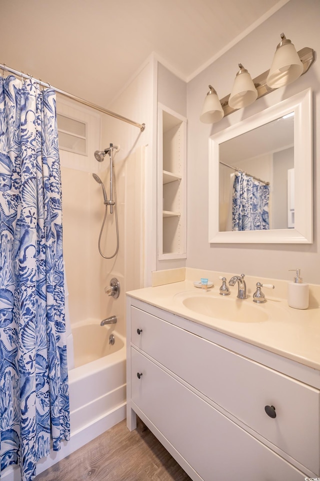 bathroom featuring hardwood / wood-style floors, vanity, and shower / tub combo with curtain