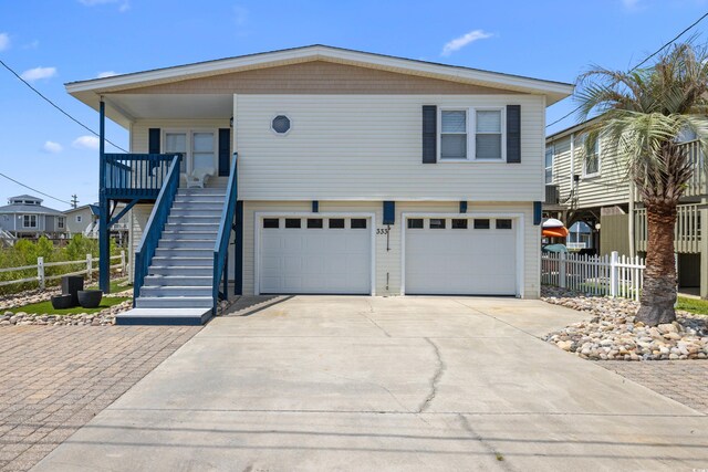 view of front facade with covered porch and a garage