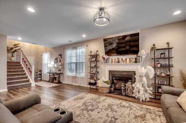 5433 Merrywind Ct, Myrtle Beach, SC 29579 - living area with stairs, wood finished floors, a glass covered fireplace, and recessed lighting