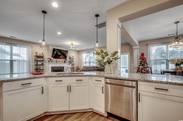 5433 Merrywind Ct, Myrtle Beach, SC 29579 - kitchen with dishwasher, plenty of natural light, light stone countertops, and recessed lighting