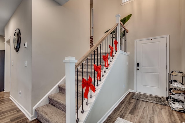 5433 Merrywind Ct, Myrtle Beach, SC 29579 - staircase featuring wood finished floors and a towering ceiling