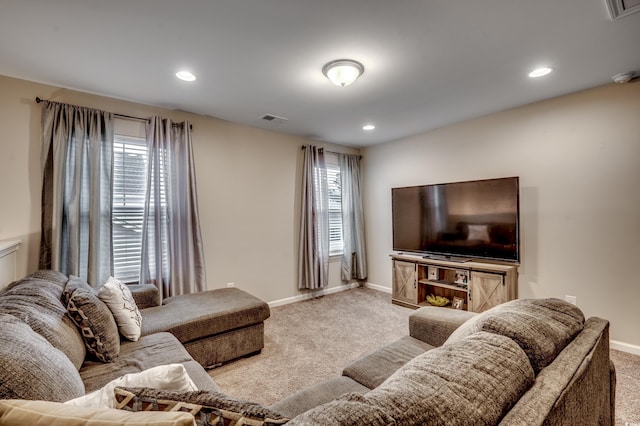 carpeted living room with a healthy amount of sunlight