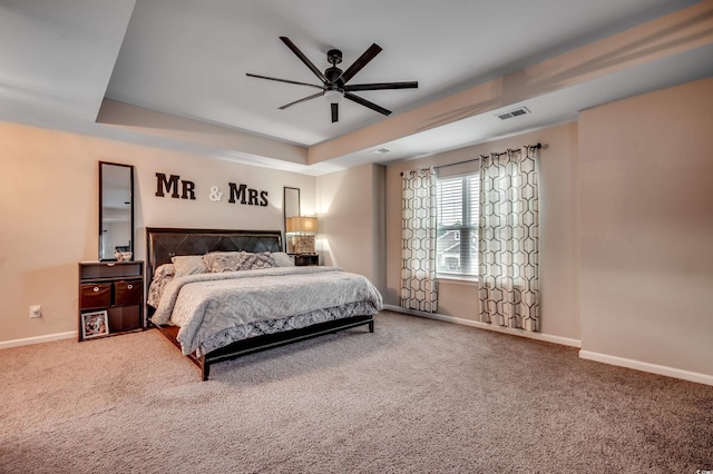 5433 Merrywind Ct, Myrtle Beach, SC 29579 - bedroom with a tray ceiling, carpet, and a ceiling fan