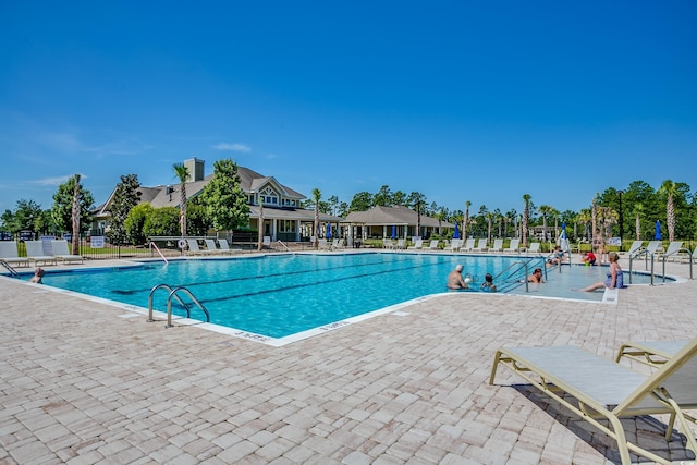 5433 Merrywind Ct, Myrtle Beach, SC 29579 - community pool featuring a patio area