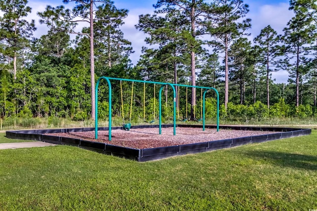 view of playground featuring a lawn