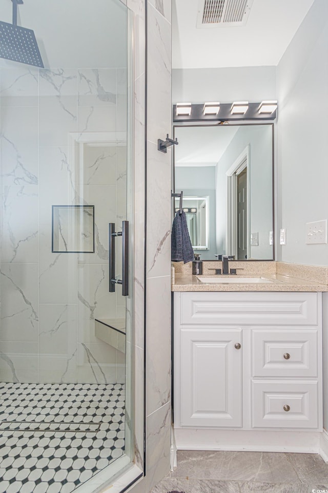 bathroom featuring vanity and walk in shower