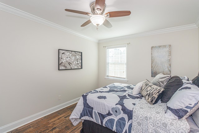 bedroom featuring ceiling fan, crown molding, and dark wood-type flooring