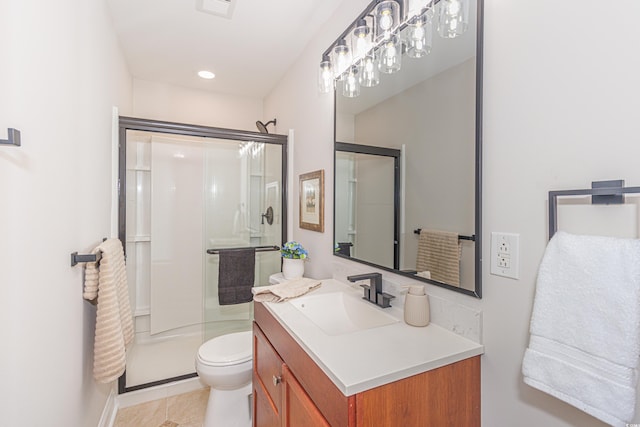 bathroom with tile patterned flooring, vanity, toilet, and a shower with door