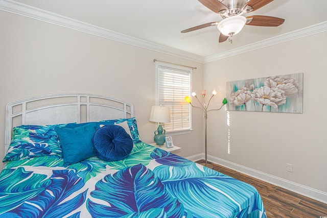 bedroom featuring ceiling fan, dark hardwood / wood-style flooring, and crown molding