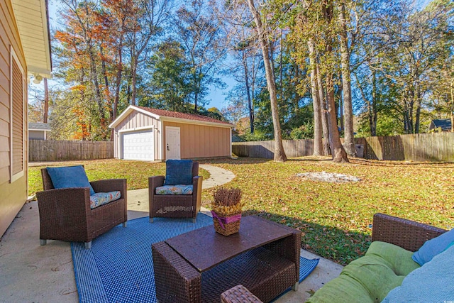 view of patio / terrace featuring an outdoor living space, an outbuilding, and a garage