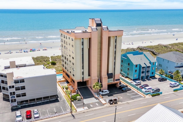 birds eye view of property featuring a water view and a view of the beach