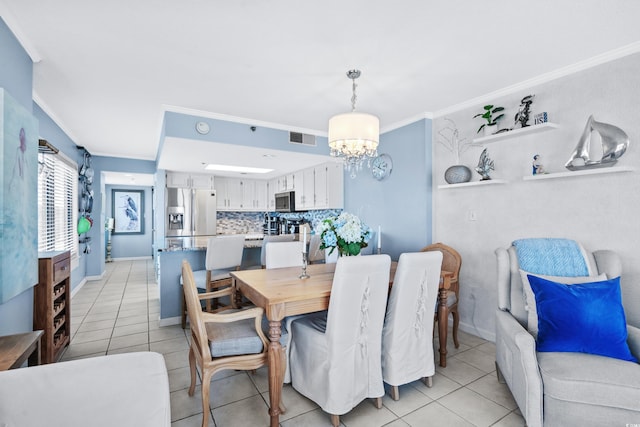 tiled dining room with an inviting chandelier and crown molding