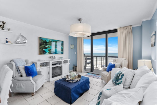 living room featuring light tile patterned floors, a water view, floor to ceiling windows, and crown molding