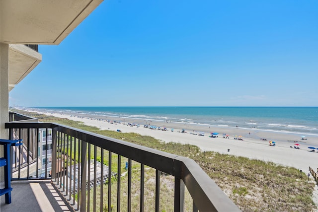 balcony with a beach view and a water view