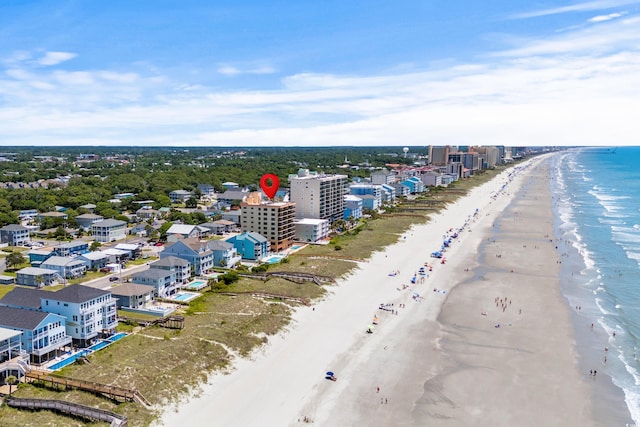 drone / aerial view with a water view and a view of the beach