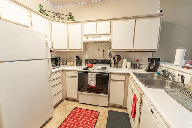 kitchen featuring sink, white cabinets, and white appliances