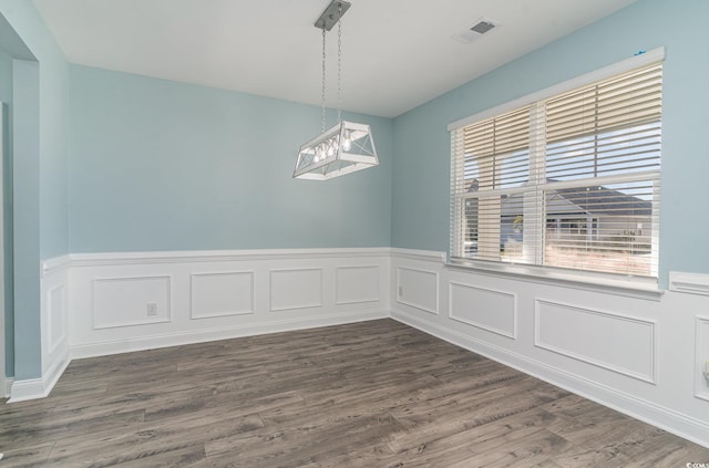 empty room with dark hardwood / wood-style floors