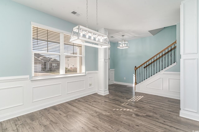 unfurnished dining area with hardwood / wood-style floors