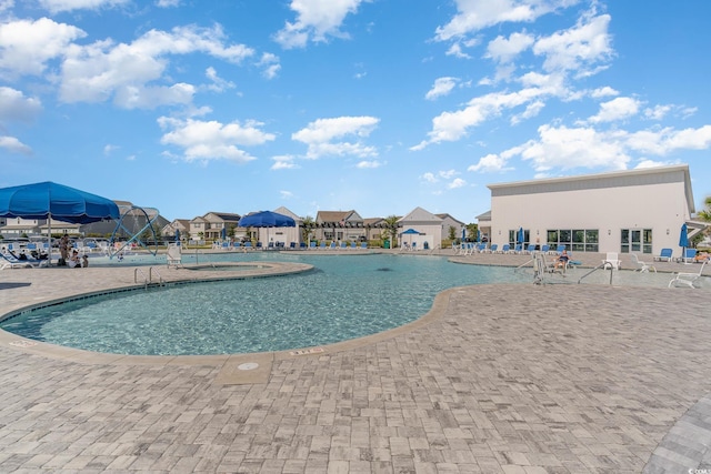 view of swimming pool with a patio area