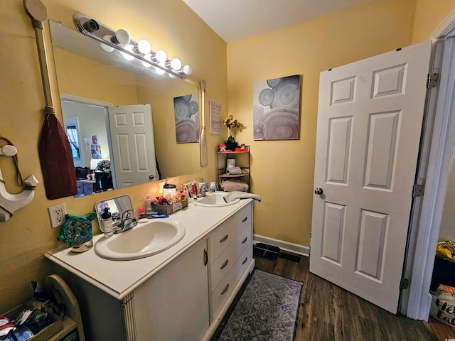 bathroom featuring hardwood / wood-style flooring and vanity