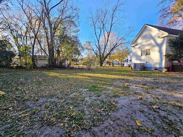 view of yard featuring central AC unit