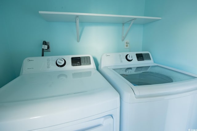 laundry area featuring washing machine and clothes dryer