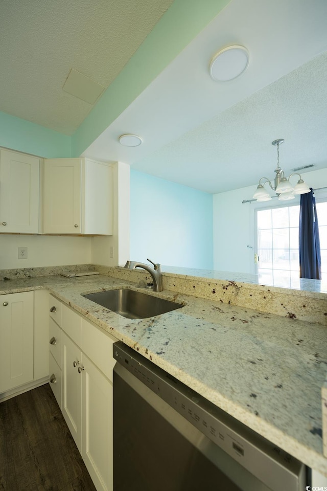 kitchen featuring dishwasher, sink, dark hardwood / wood-style floors, a chandelier, and white cabinets