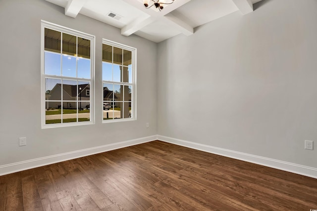 unfurnished room featuring beamed ceiling, dark wood-type flooring, and a chandelier