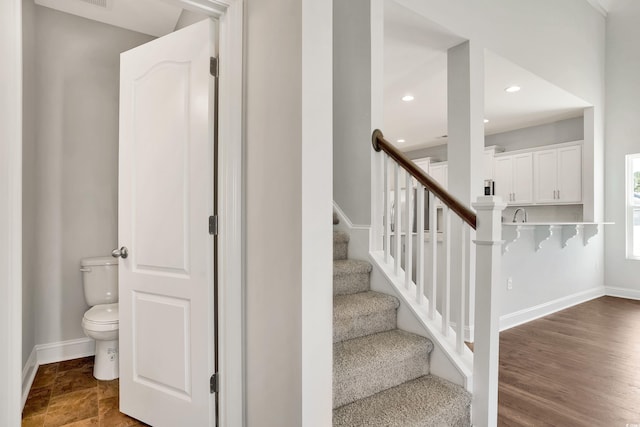 stairway featuring hardwood / wood-style flooring