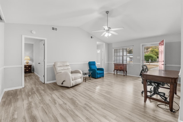 office space with ceiling fan, light hardwood / wood-style floors, and vaulted ceiling