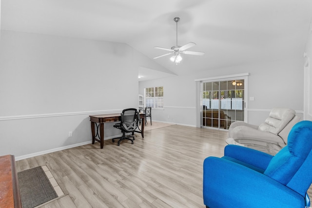 home office with light wood-type flooring, vaulted ceiling, and ceiling fan