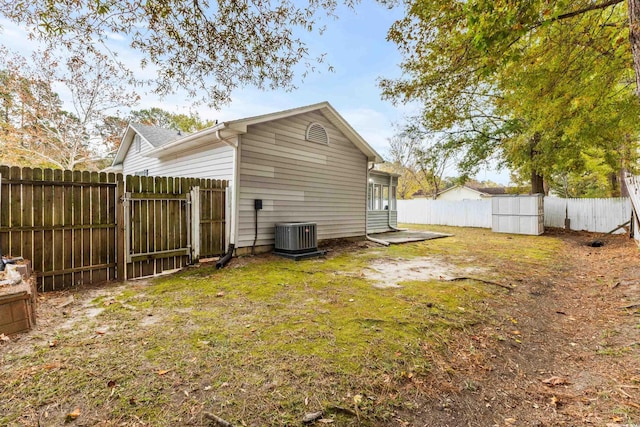 exterior space featuring a yard and central AC unit