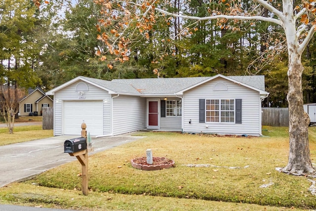 ranch-style home featuring a garage and a front lawn