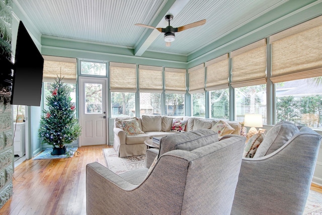 living room with light wood-type flooring, ceiling fan, and ornamental molding