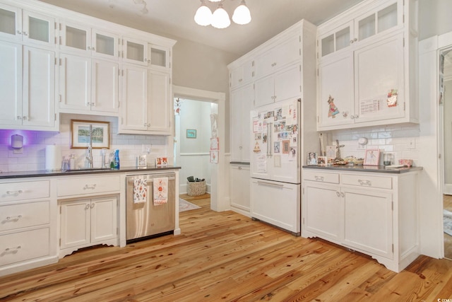 kitchen featuring light wood-type flooring, white refrigerator, white cabinetry, and stainless steel dishwasher