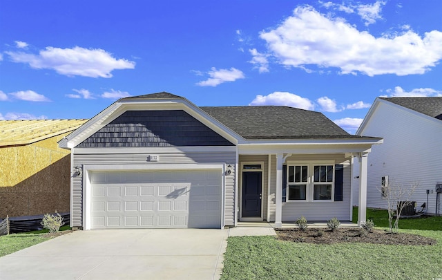 view of front facade with driveway, central AC, and a garage