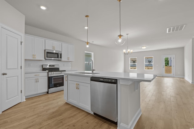 1200 NW Calabash Station Blvd, Calabash, NC 28467 - kitchen with visible vents, appliances with stainless steel finishes, light countertops, and a sink