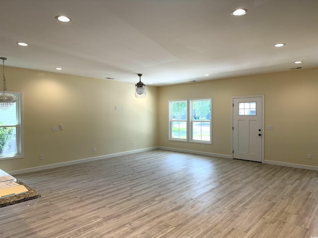 unfurnished living room featuring light hardwood / wood-style flooring