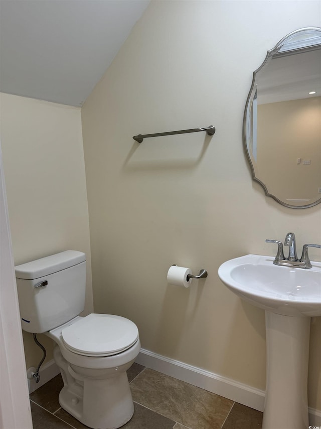 bathroom featuring tile patterned floors, sink, and toilet