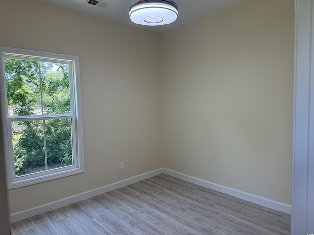 empty room with light hardwood / wood-style floors